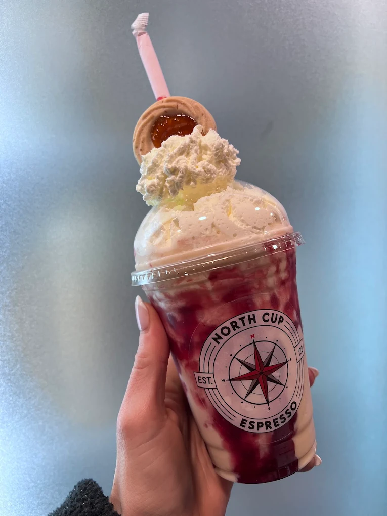 Berry blended drink with a cookie garnish